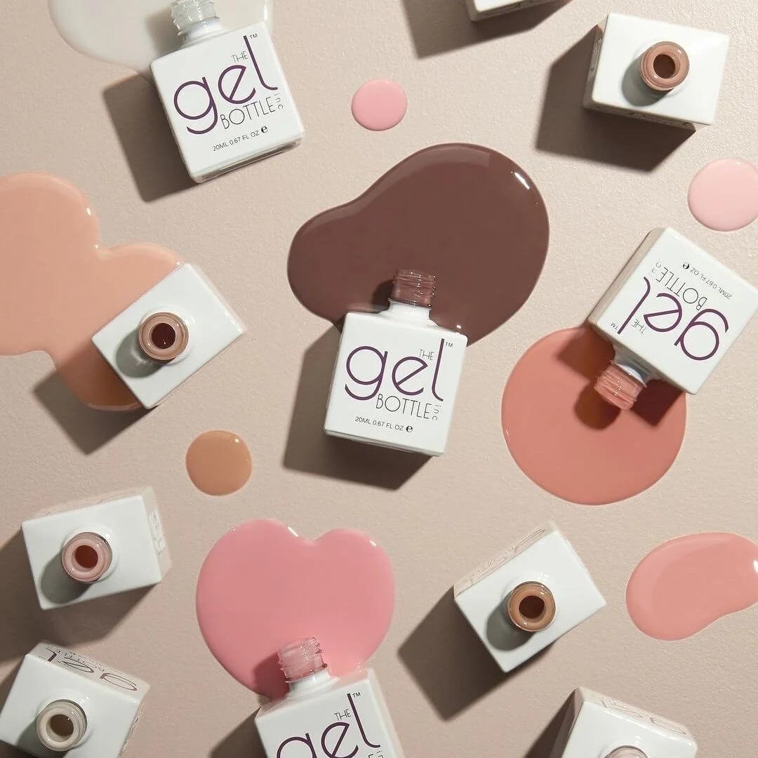 The GelBottle gel polish bottles in nude, blush and chocolate brown shades, used for gel manicures at Paint Nails London